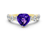 Yellow gold Heart Cut Tanzanite Prong Setting with Side Stones on a Pave Band
