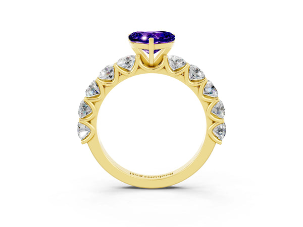Yellow gold Heart Cut Tanzanite Prong Setting with Side Stones on a Pave Band