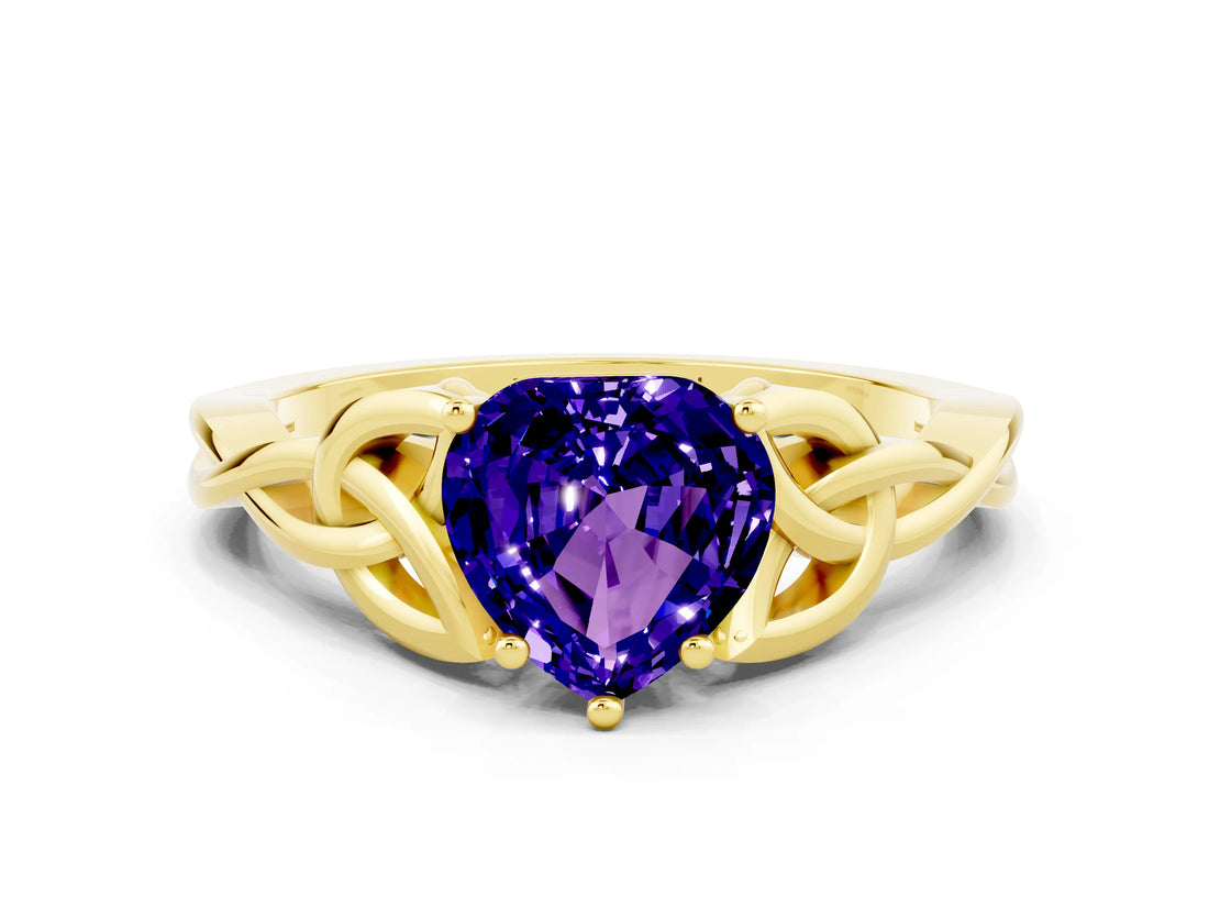 Yellow gold Heart Cut Tanzanite Solitaire Engagement Ring with Celtic Knot Band and Four-Prong Setting