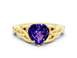 Yellow gold Heart Cut Tanzanite Solitaire Engagement Ring with Celtic Knot Band and Four-Prong Setting