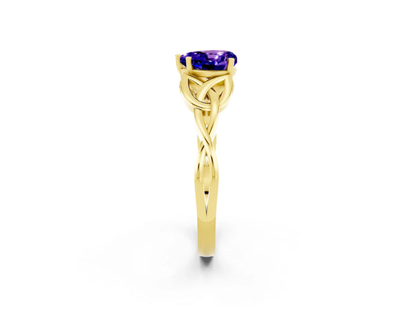 Yellow gold Heart Cut Tanzanite Solitaire Engagement Ring with Celtic Knot Band and Four-Prong Setting