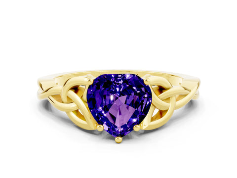 Yellow gold Heart Cut Tanzanite Solitaire Engagement Ring with Celtic Knot Band and Four-Prong Setting