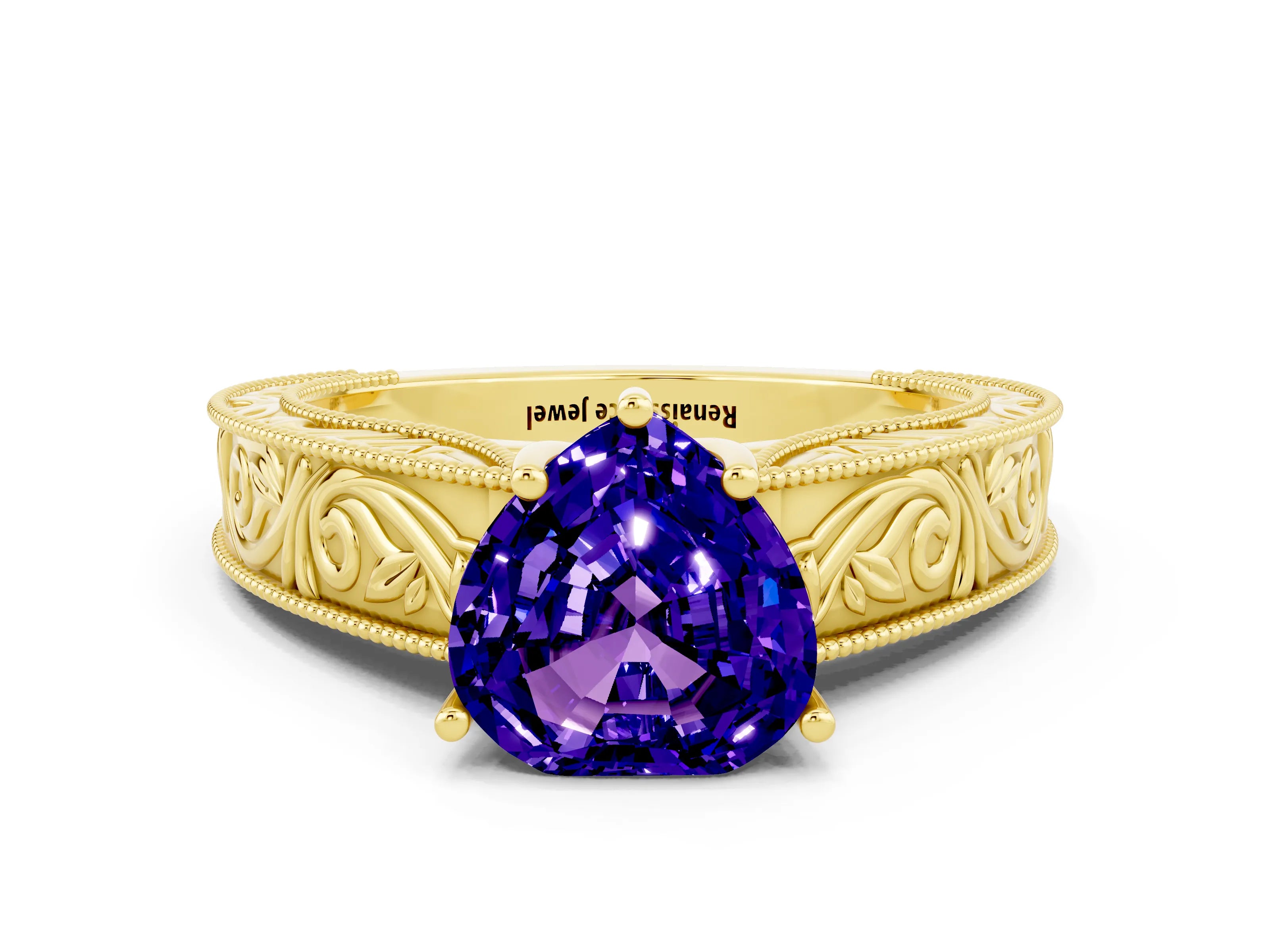 Yellow gold Heart Cut Tanzanite Solitaire Ring with Engraved Band and Four-Prong Setting