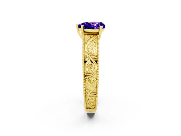 Yellow gold Heart Cut Tanzanite Solitaire Ring with Engraved Band and Four-Prong Setting