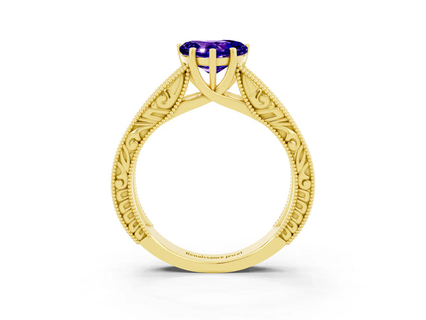Yellow gold Heart Cut Tanzanite Solitaire Ring with Engraved Band and Four-Prong Setting
