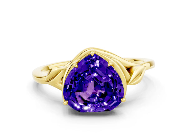 Yellow gold Heart Cut Tanzanite Solitaire Ring with Twist Band and Four-Prong Setting
