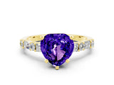 Yellow gold Heart Cut Tanzanite Solitaire with Side Baguettes and Channel Set Band