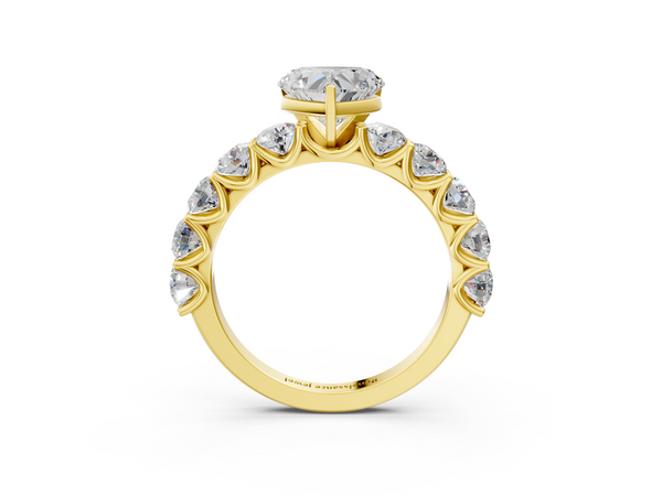 Yellow gold Heart Cut Diamond Prong Setting with Side Stones on a Pave Band