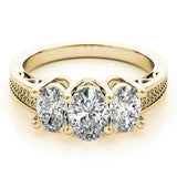 Yellow gold Heart Diamond Three-Stone Ring with Prong Setting and Textured Band 2
