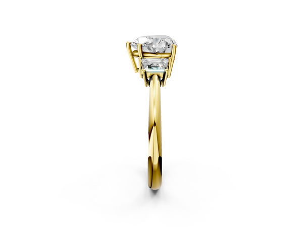 Yellow gold Heart Diamond Three-Stone Ring with Trapezoid Side Stones and Prong Setting