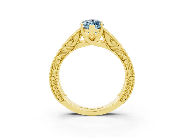 Yellow gold Marquise Cut Aquamarine Solitaire Ring with Engraved Band and Four-Prong Setting