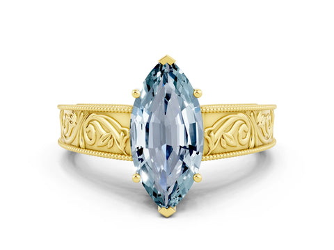 Yellow gold Marquise Cut Aquamarine Solitaire Ring with Engraved Band and Four-Prong Setting