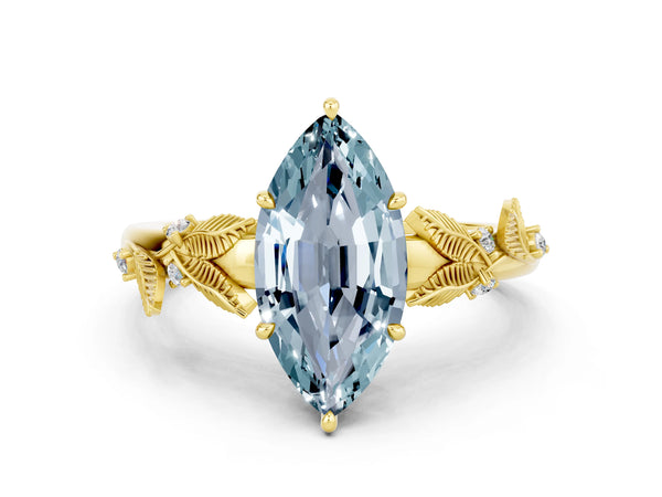 Yellow gold Marquise Cut Aquamarine Solitaire Ring with Leaf Motif Band and Four-Prong Setting
