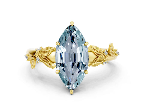 Yellow gold Marquise Cut Aquamarine Solitaire Ring with Leaf Motif Band and Four-Prong Setting