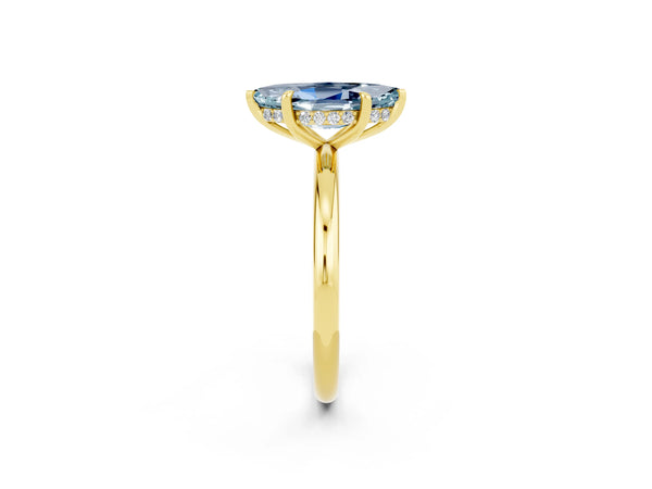 Yellow gold Marquise Cut Aquamarine Solitaire Ring with Thin Band and Four-Prong Setting