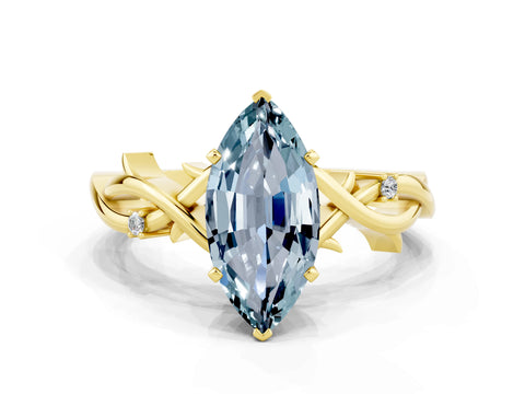 Yellow gold Marquise Cut Aquamarine Solitaire Ring with Twisted Band and Prong Setting