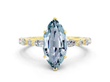 Yellow gold Marquise Cut Aquamarine Solitaire with Side Stones on a Pavé Band and Four-Prong Setting