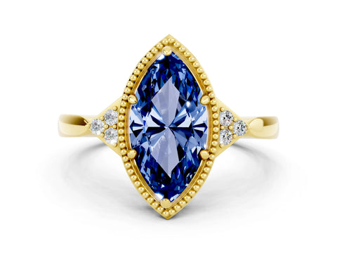 Yellow gold Marquise Cut Blue Sapphire Halo Ring with Tapered Band and Four-Prong Setting