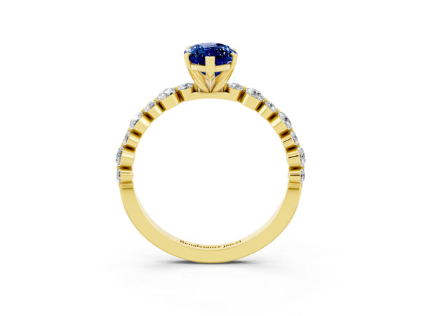 Yellow gold Marquise Cut Blue Sapphire Prong Set Engagement Ring with Pavé Band