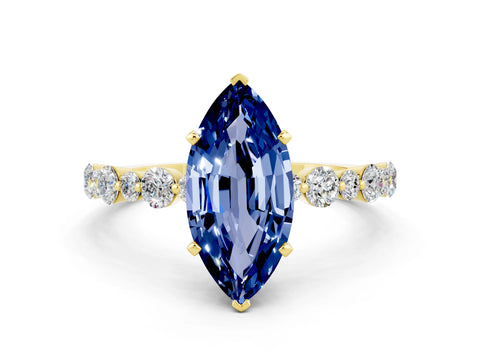 Yellow gold Marquise Cut Blue Sapphire Prong Set Engagement Ring with Pavé Band