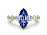 Yellow gold Marquise Cut Blue Sapphire Prong Setting with Side Stones on a Pave Band