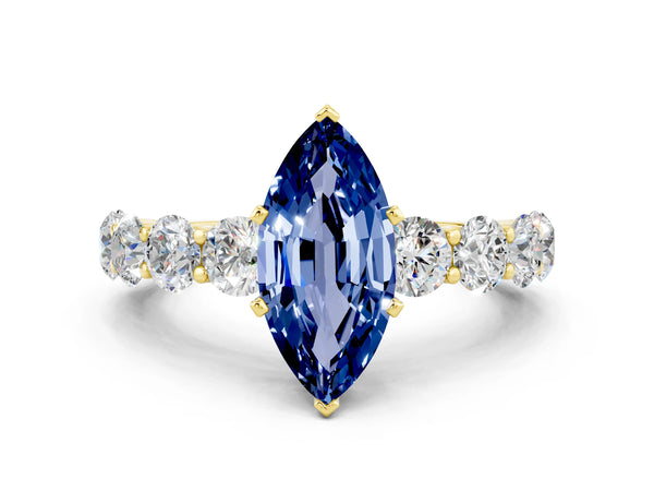 Yellow gold Marquise Cut Blue Sapphire Prong Setting with Side Stones on a Pave Band