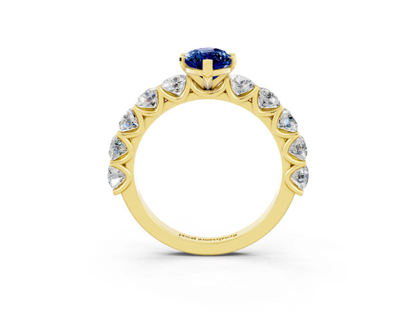 Yellow gold Marquise Cut Blue Sapphire Prong Setting with Side Stones on a Pave Band