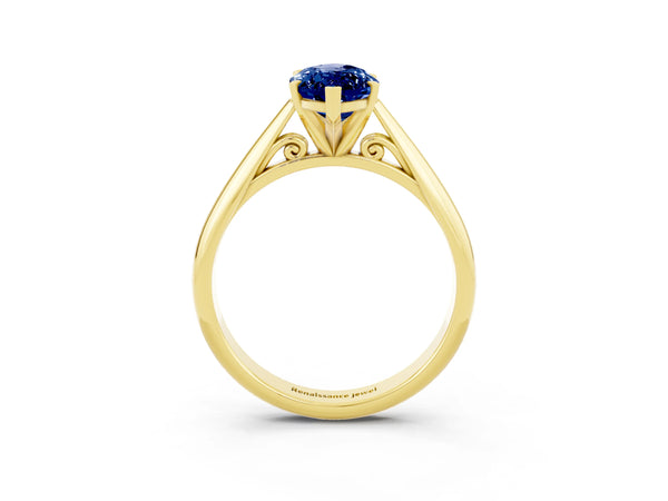 Yellow gold Marquise Cut Blue Sapphire Solitaire Engagement Ring with Cathedral Setting and Four-Prong Mount