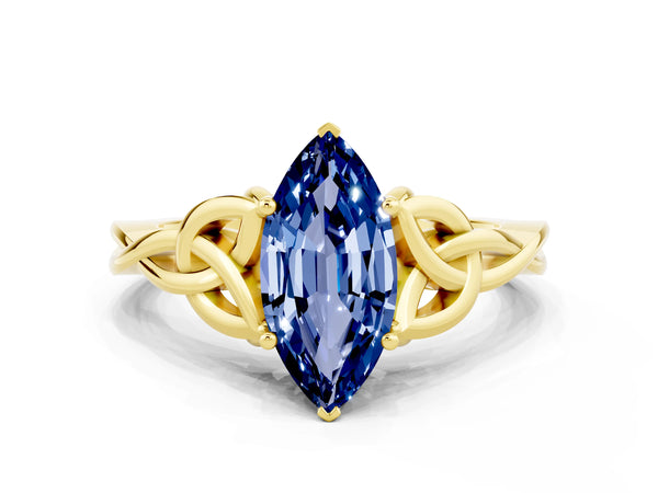 Yellow gold Marquise Cut Blue Sapphire Solitaire Engagement Ring with Celtic Knot Band and Four-Prong Setting