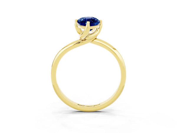 Yellow gold Marquise Cut Blue Sapphire Solitaire Engagement Ring with Four-Prong Setting and Classic Band