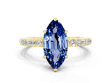 Yellow gold Marquise Cut Blue Sapphire Solitaire Engagement Ring with Pavé Band and Four-Prong Setting