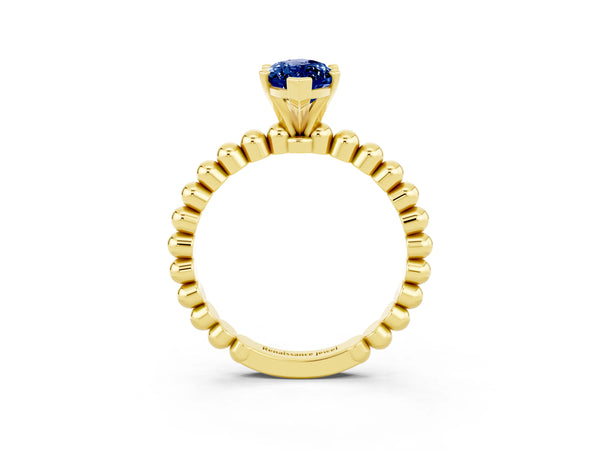 Yellow gold Marquise Cut Blue Sapphire Solitaire Ring with Beaded Band and Prong Setting