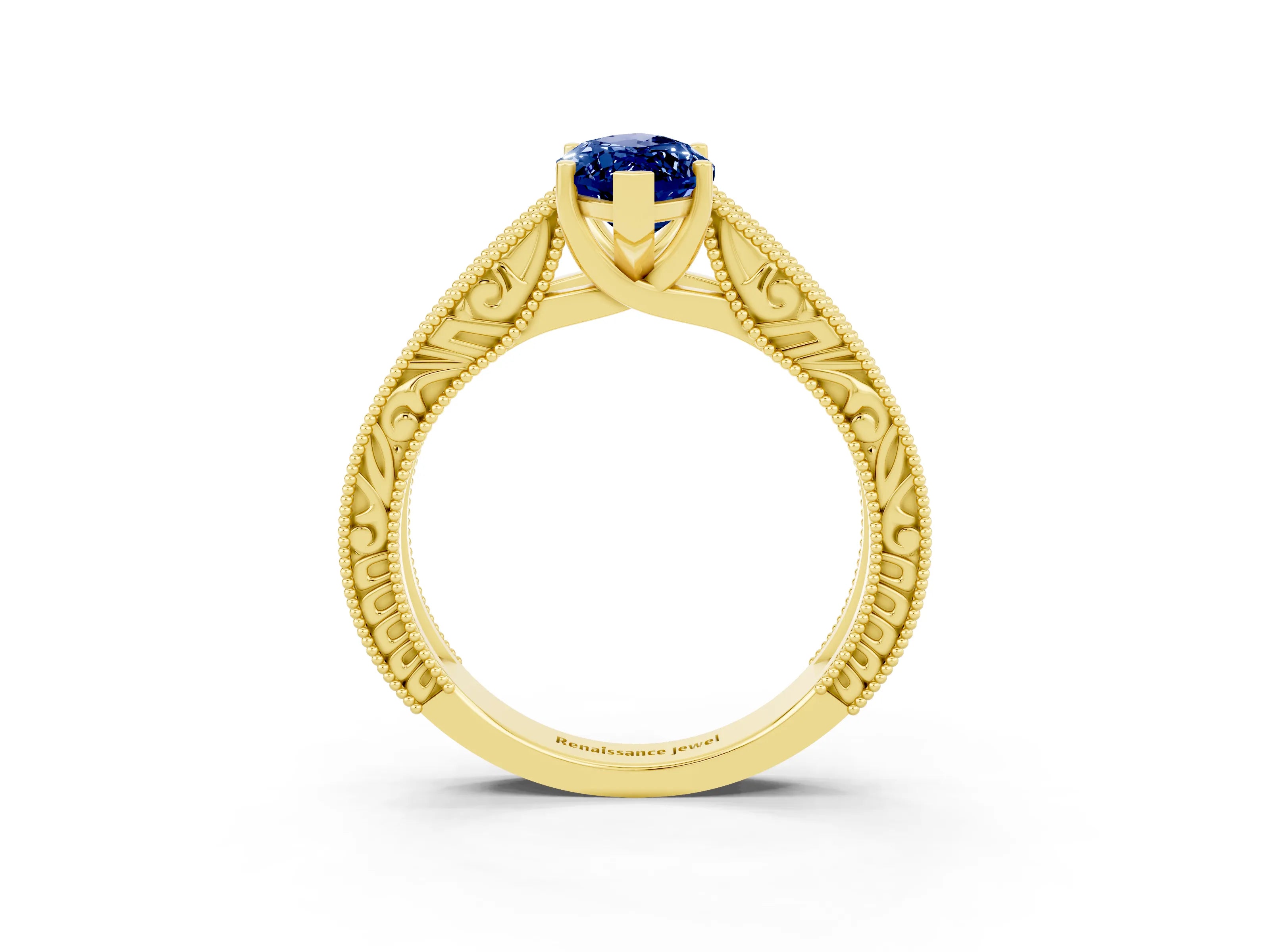 Yellow gold Marquise Cut Blue Sapphire Solitaire Ring with Engraved Band and Four-Prong Setting_3