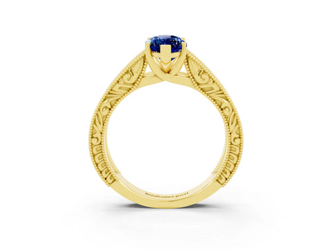 Yellow gold Marquise Cut Blue Sapphire Solitaire Ring with Engraved Band and Four-Prong Setting_3