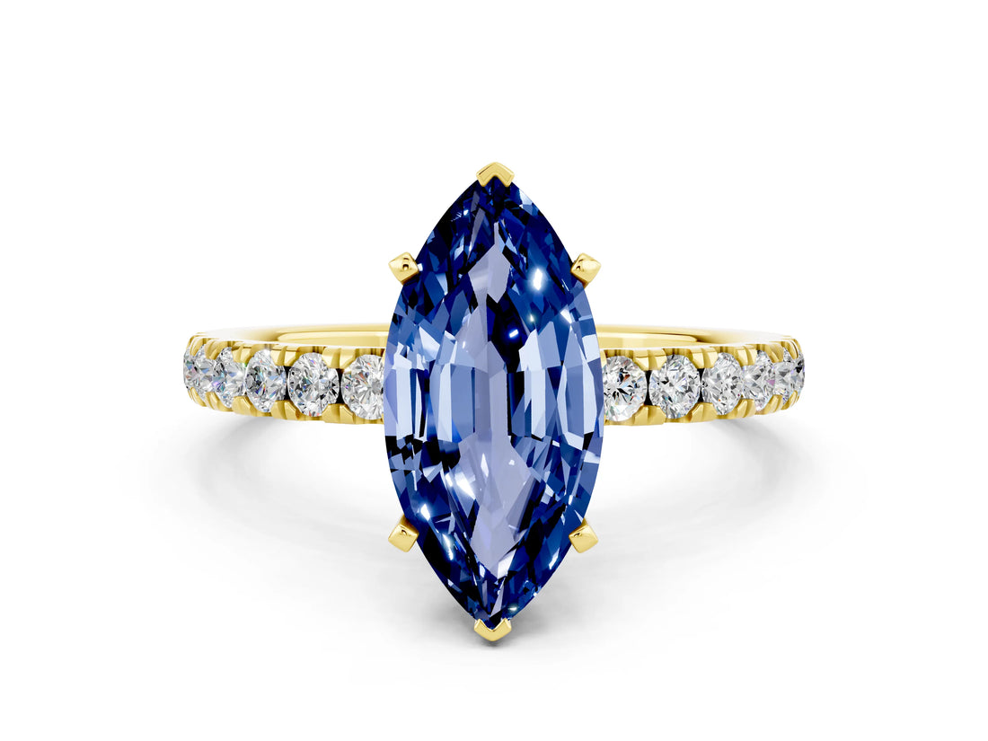 Yellow gold Marquise Cut Blue Sapphire Solitaire Ring with Pavé Accents and Four-Prong Setting