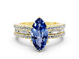 Yellow gold Marquise Cut Blue Sapphire Solitaire Ring with Pavé and Channel Set Band