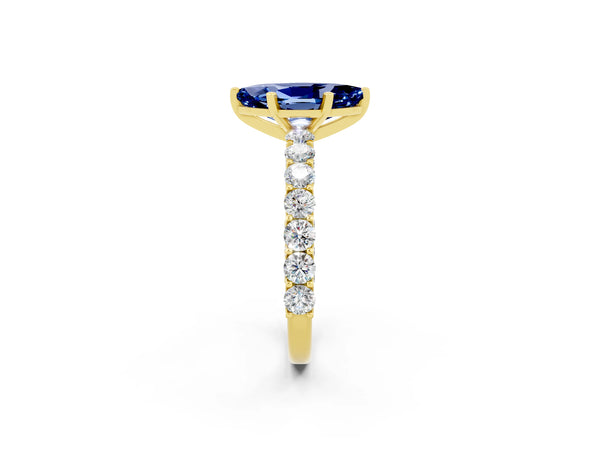 Yellow gold Marquise Cut Blue Sapphire Solitaire Ring with Shared Prong Pavé Band and Four-Prong Setting