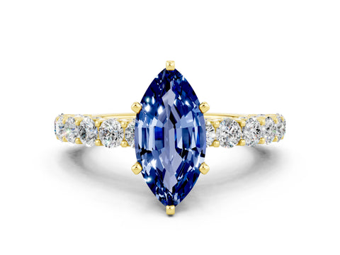 Yellow gold Marquise Cut Blue Sapphire Solitaire Ring with Shared Prong Pavé Band and Four-Prong Setting