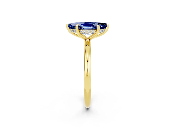 Yellow gold Marquise Cut Blue Sapphire Solitaire Ring with Thin Band and Four-Prong Setting