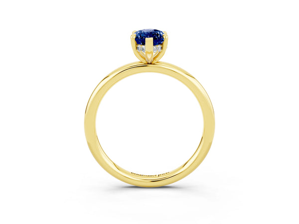 Yellow gold Marquise Cut Blue Sapphire Solitaire Ring with Thin Band and Four-Prong Setting
