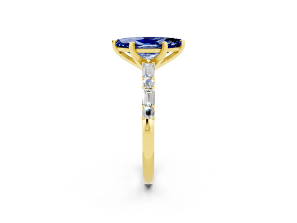 Yellow gold Marquise Cut Blue Sapphire Solitaire with Side Baguettes and Channel Set Band
