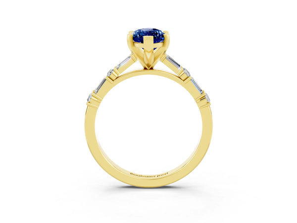 Yellow gold Marquise Cut Blue Sapphire Solitaire with Side Baguettes and Channel Set Band