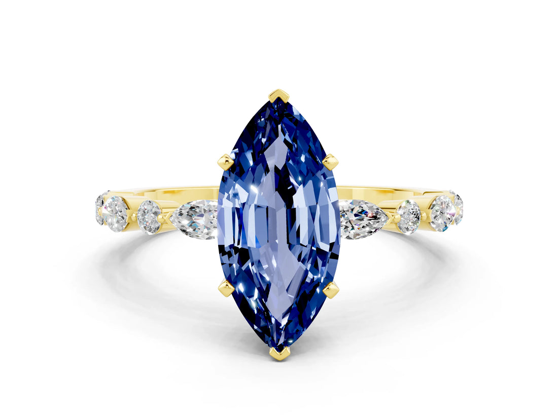 Yellow gold Marquise Cut Blue Sapphire Solitaire with Side Stones on a Pavé Band and Four-Prong Setting