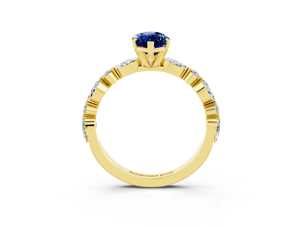 Yellow gold Marquise Cut Blue Sapphire Ring with Marquise and Round  Side Stones and Four-Prong Setting