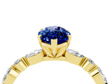 Yellow gold Marquise Cut Blue Sapphire Solitaire with Side Stones on a Pavé Band and Four-Prong Setting_4