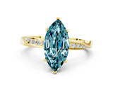 Yellow gold Marquise Cut Blue Topaz Engagement Ring with Side Stone Accents and Four-Prong Setting_60