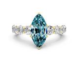 Yellow gold Marquise Cut Blue Topaz Prong Setting with Side Stones on a Pave Band