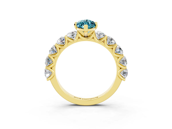 Yellow gold Marquise Cut Blue Topaz Prong Setting with Side Stones on a Pave Band