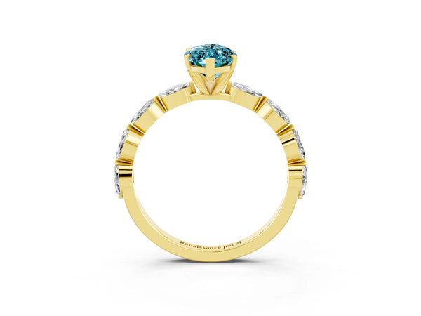 Yellow gold Marquise Cut Blue Topaz Ring with Marquise Side Stones and Prong Setting