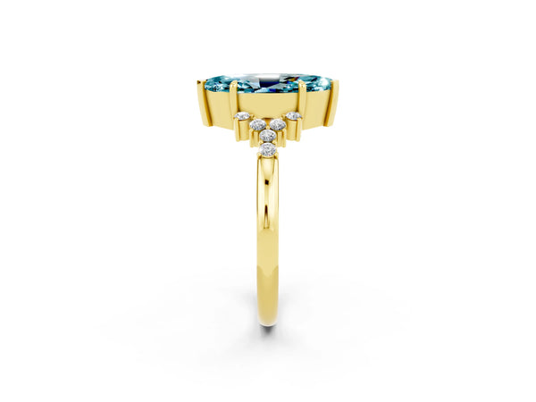 Yellow gold Marquise Cut Blue Topaz Ring with Side Stones and Four-Prong Setting